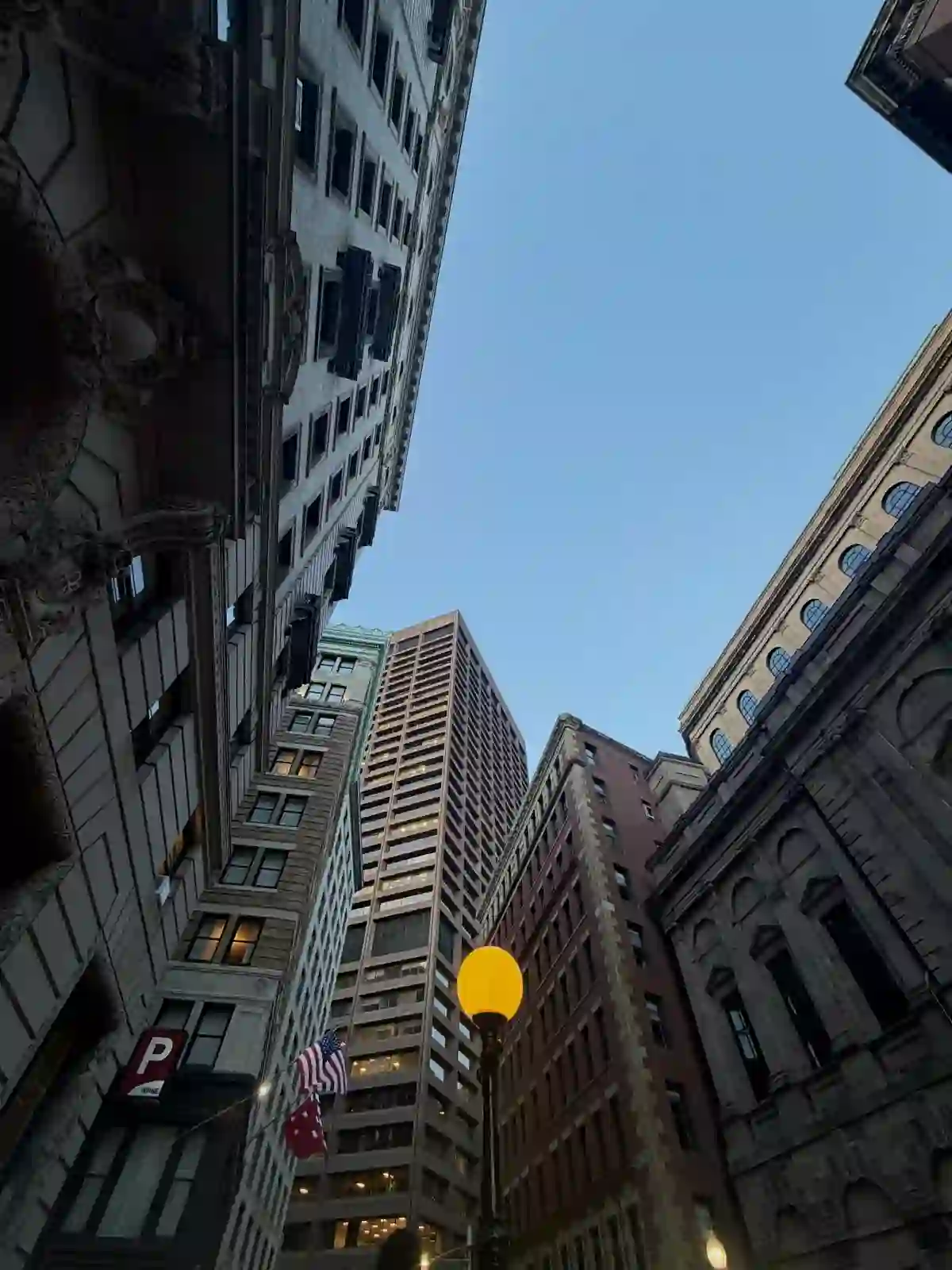 Looking up at Financial District towers in downtown Boston at dusk